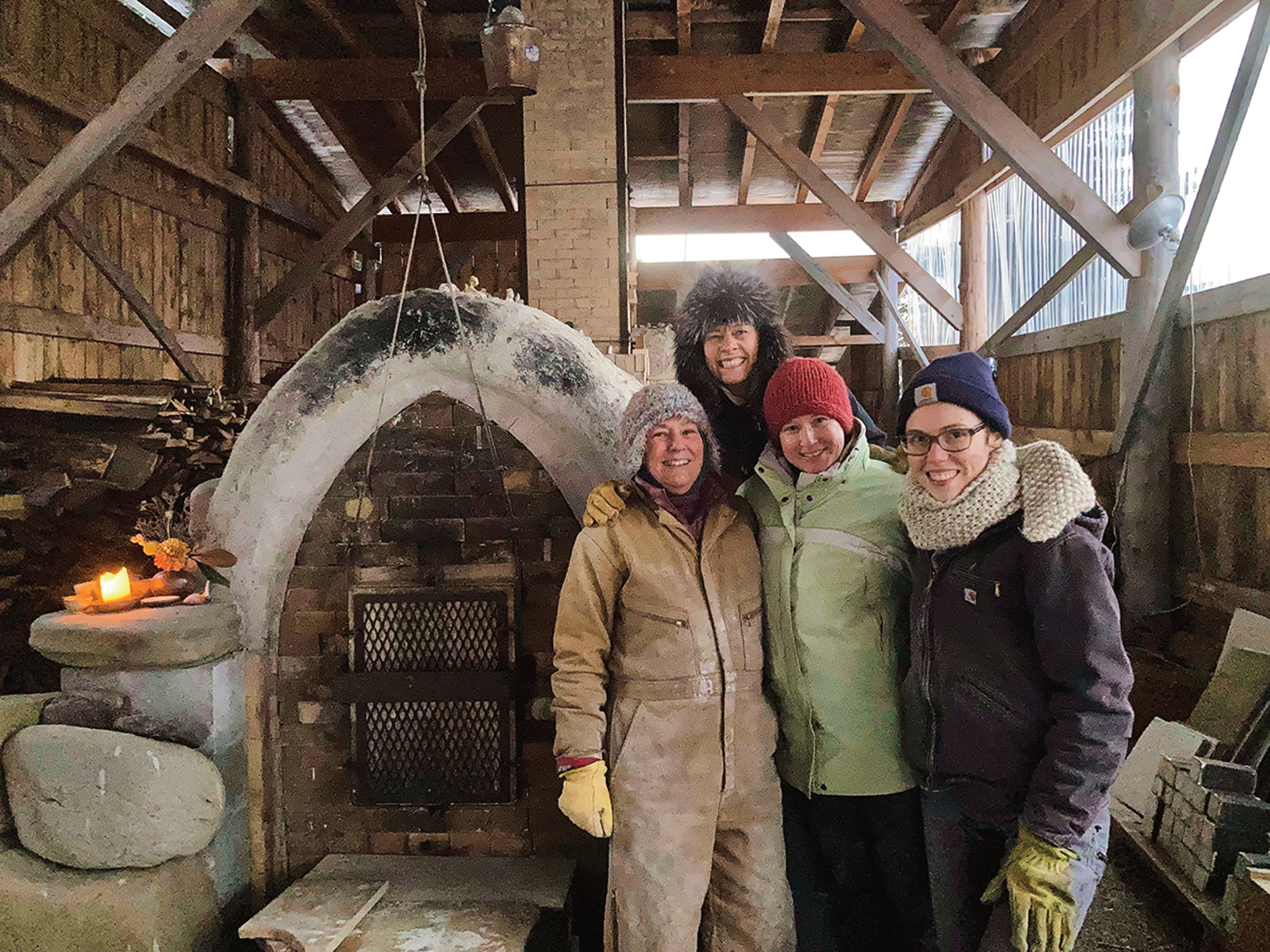 A group of people dressed for a kiln firing in subzero temperatures.