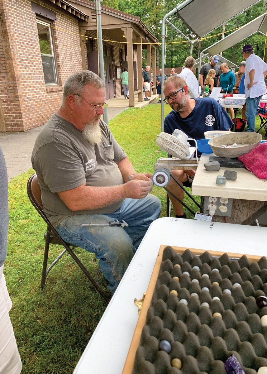 Paul Davis demonstrates how to carve marbles.