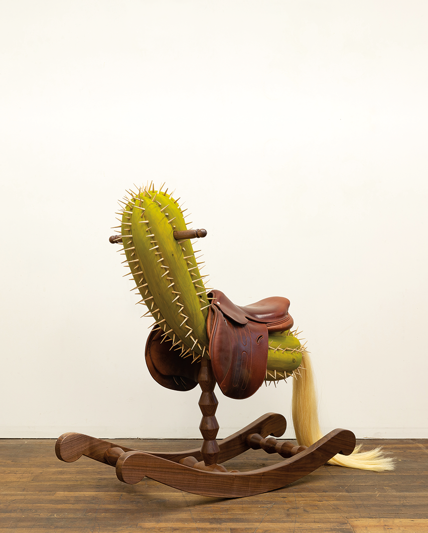 Wooden sculpture of a cactus rocking horse