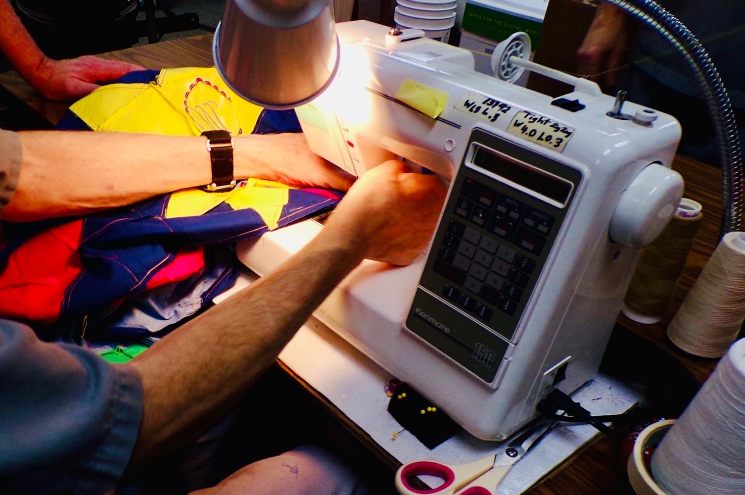 Hands working at a sewing machine