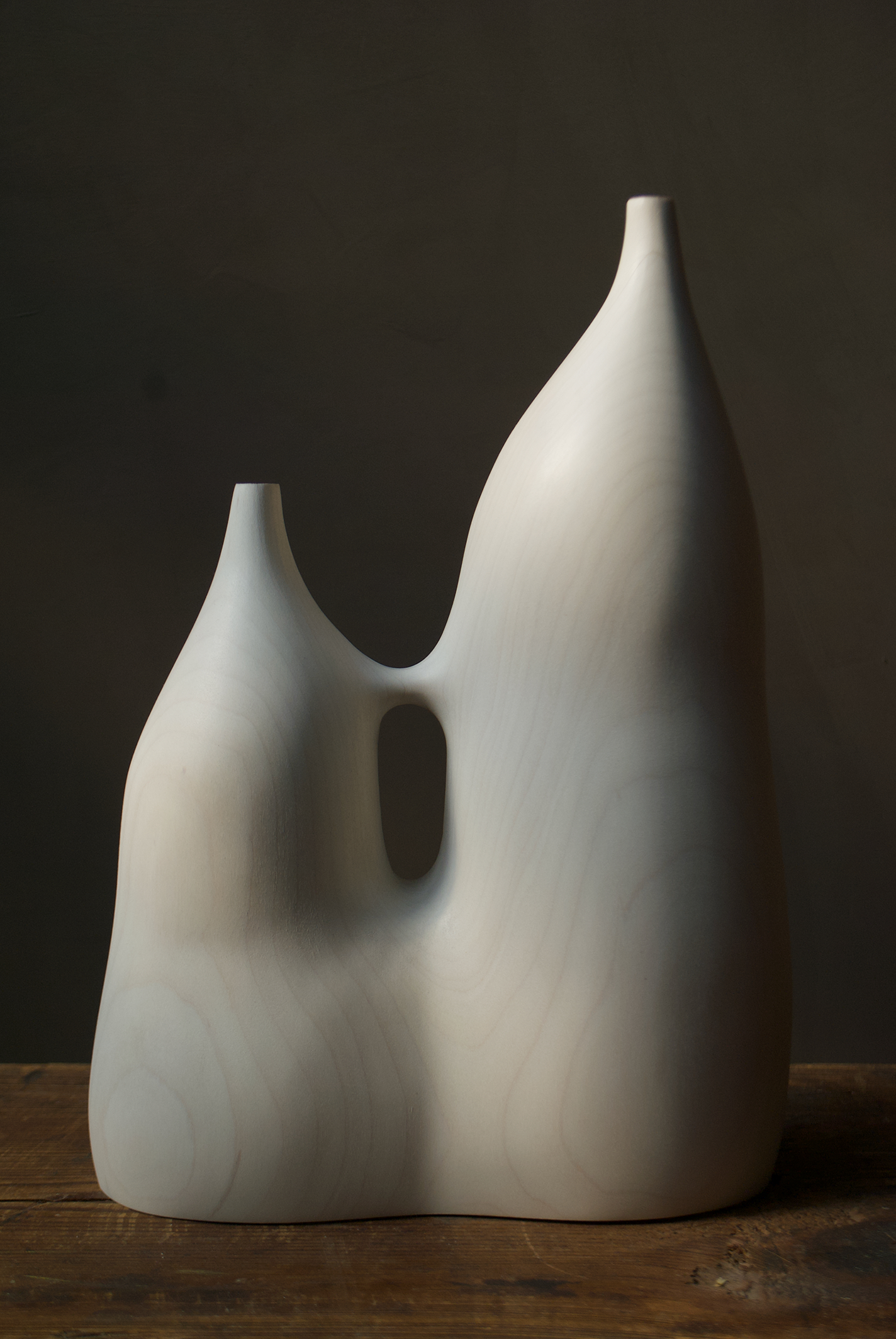 Conjoined white wood vessel