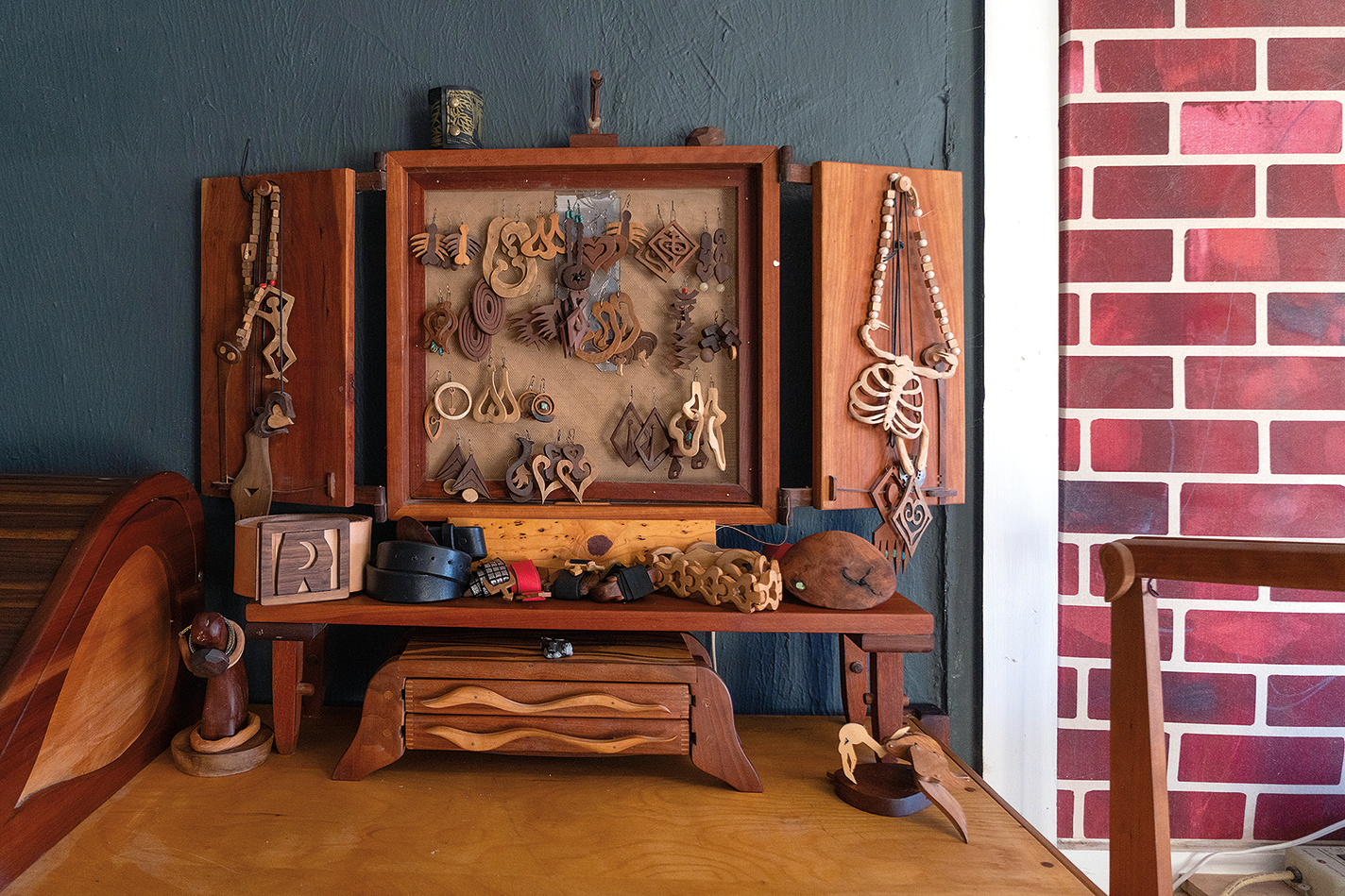 Cabinet filled with handmade wooden jewelry