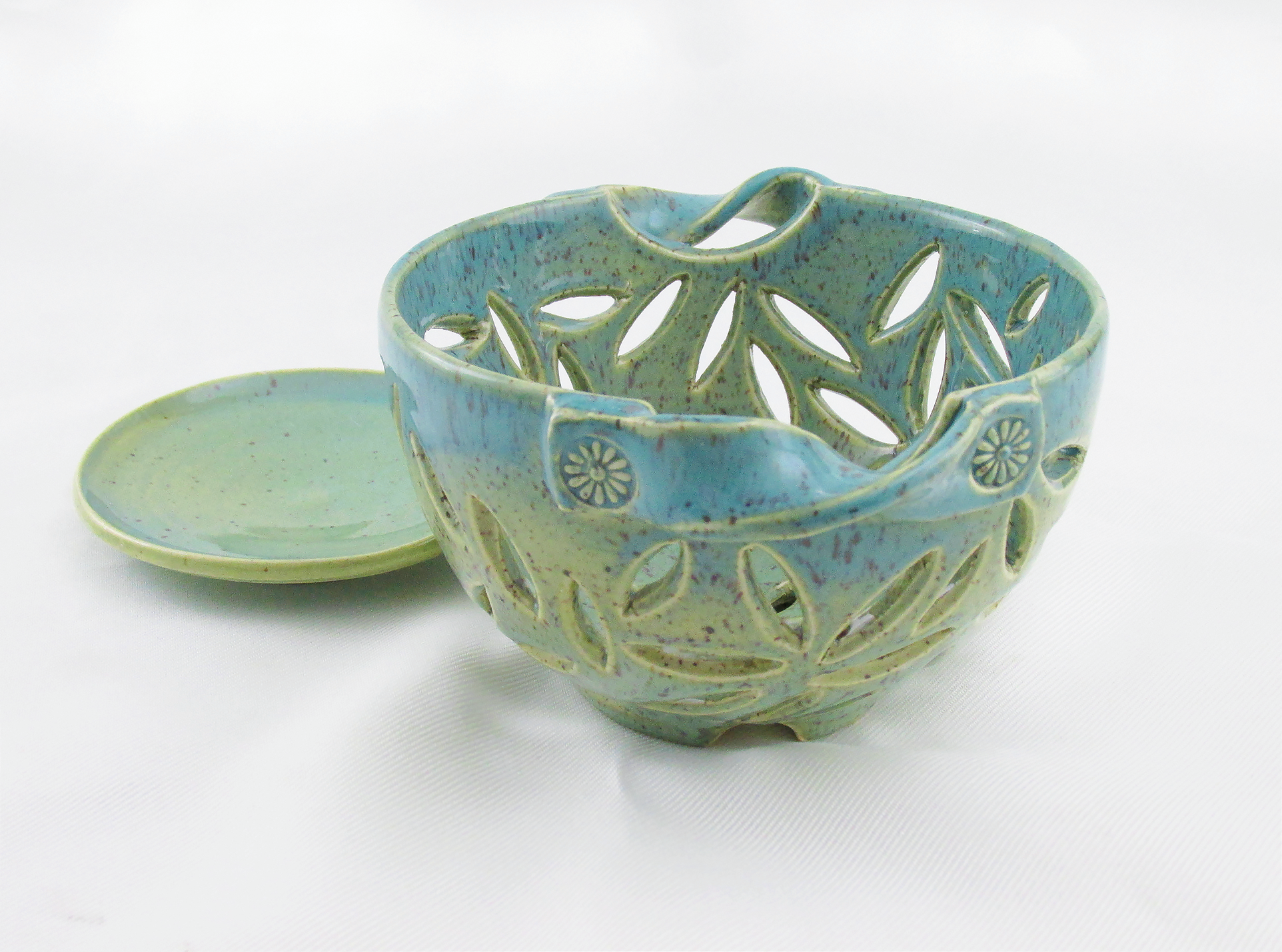 Blue-green berry bowls with leaf-shaped cutouts