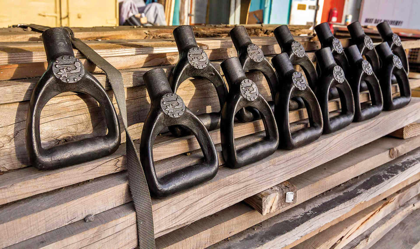 Finished shovel handles made from melted-down guns and cast iron.