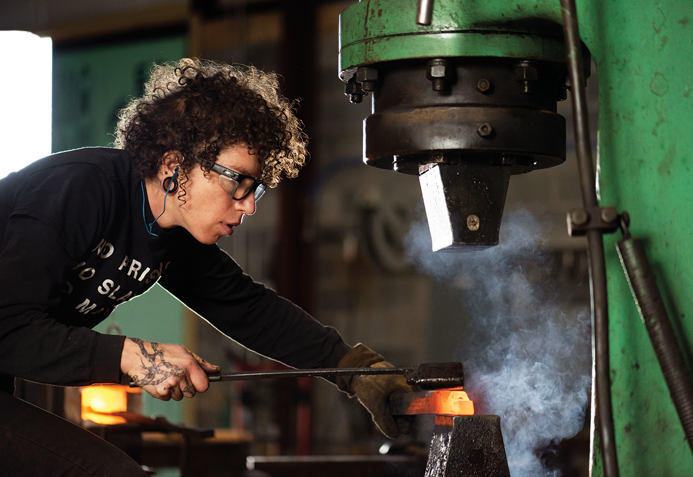 Rachel David forging in her studio.