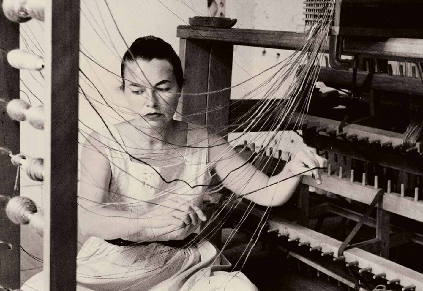 Lenore Tawney at work in her New York City studio, 1958.