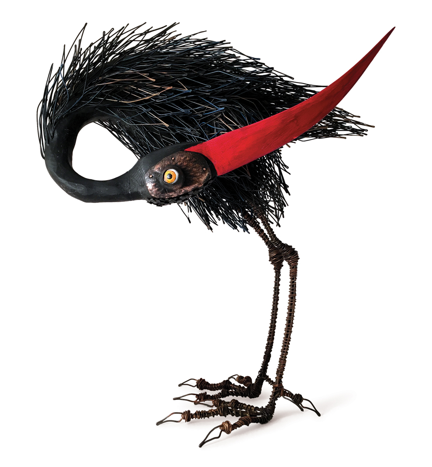 Whimsical bird sculpture with long red beak