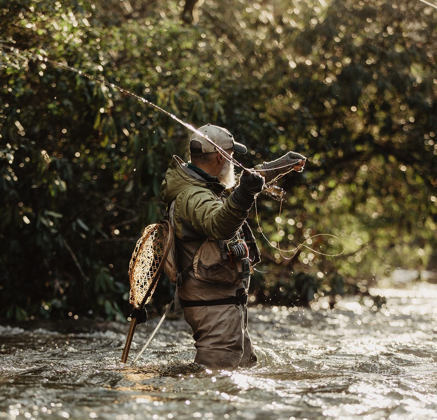 Bill Oyster fly fishing in a stream