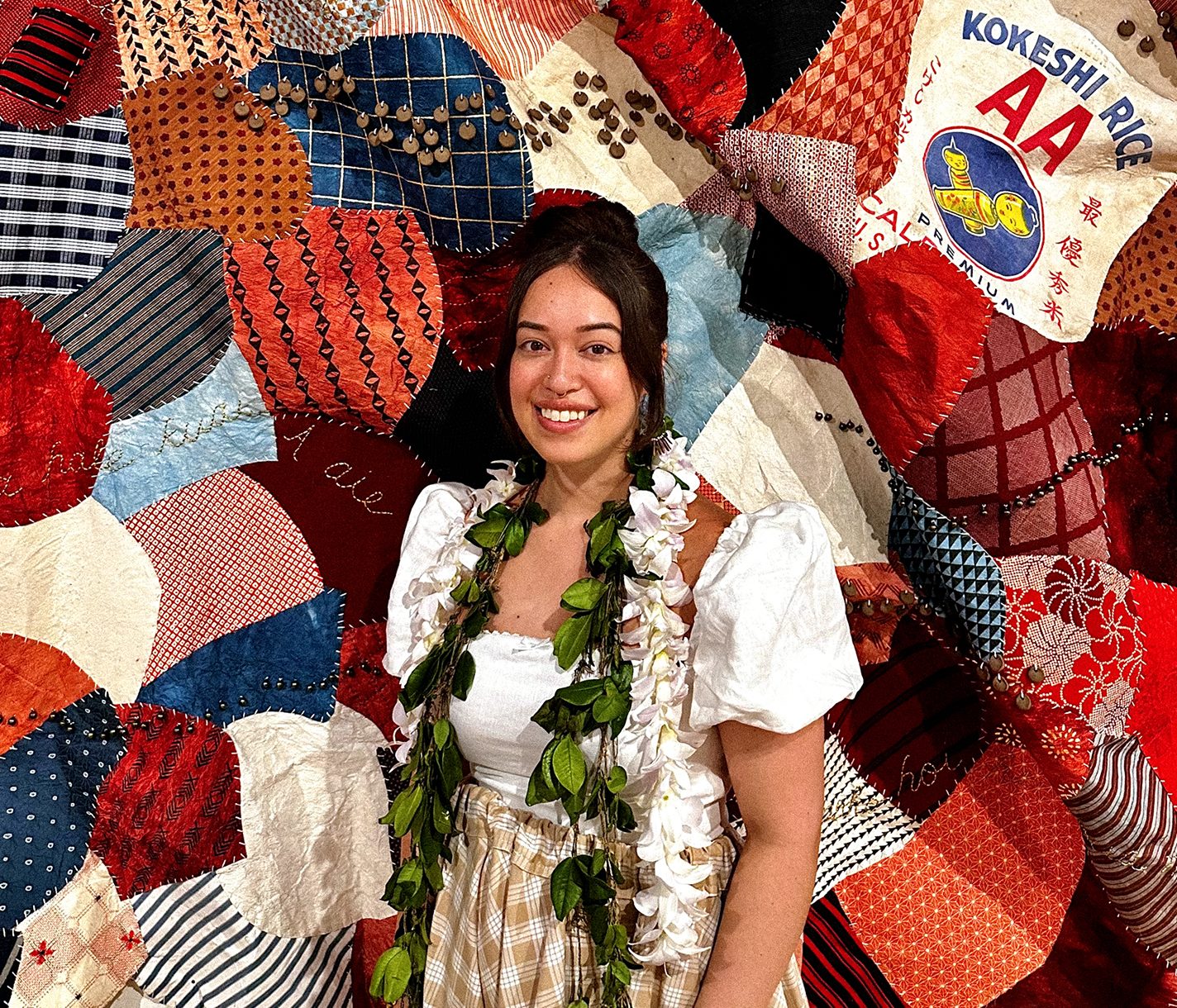 Lehuauakea stands in front of their installation.