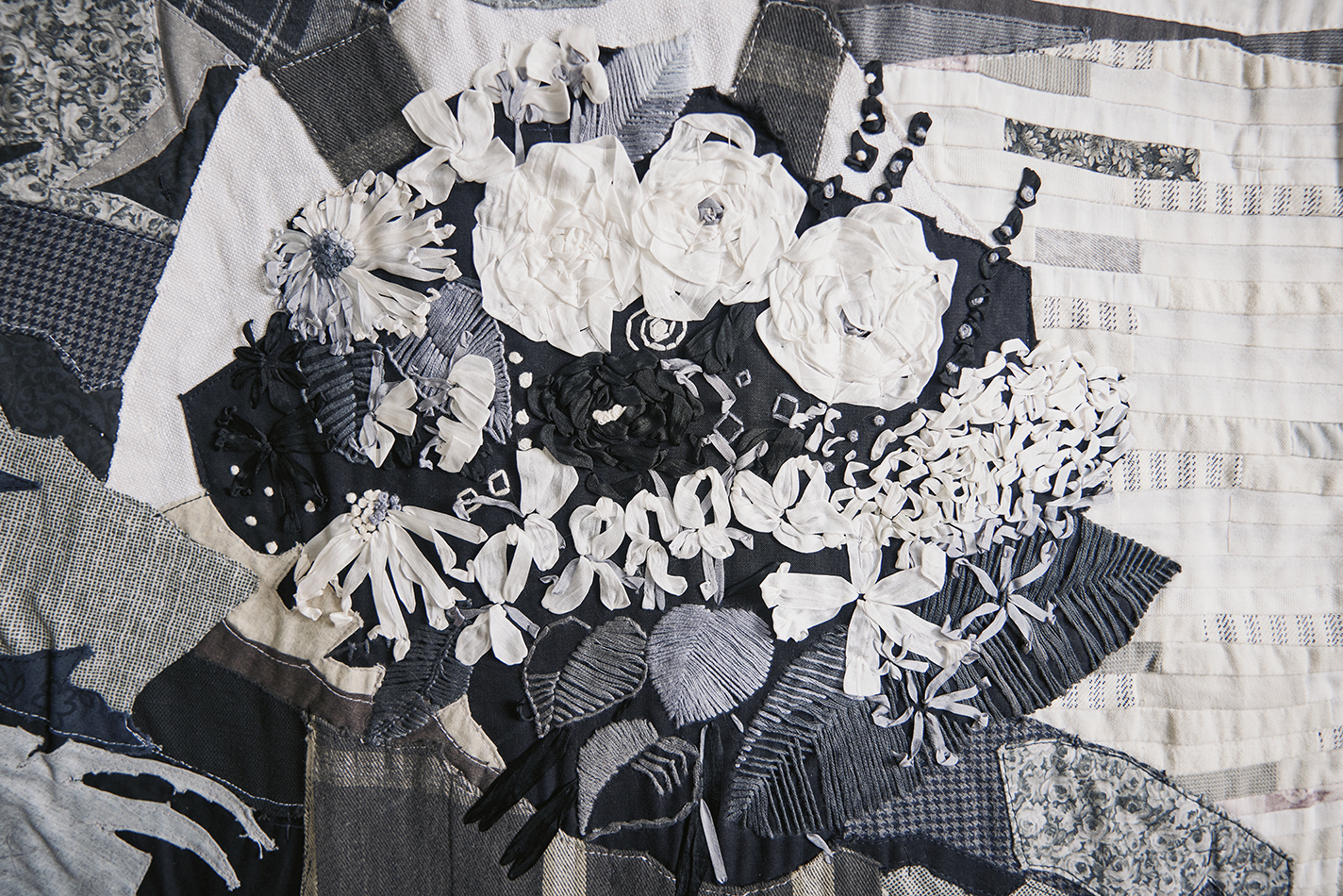 Detail of cloth painting: a silk ribbon and embroidery floss bouquet