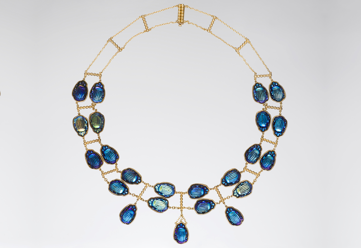 Gold necklace with glass beetle charms