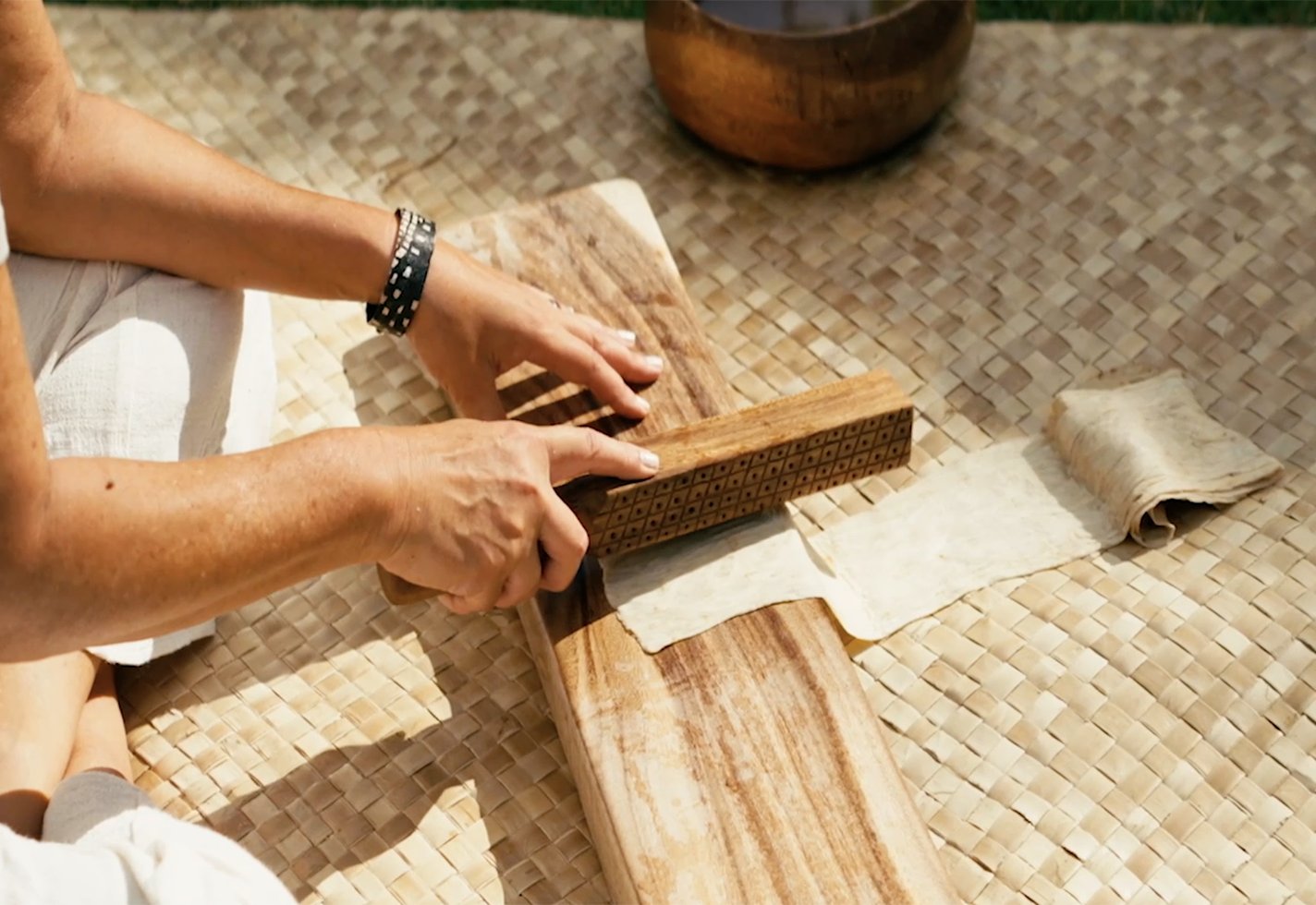 Page Chang pounding bark.