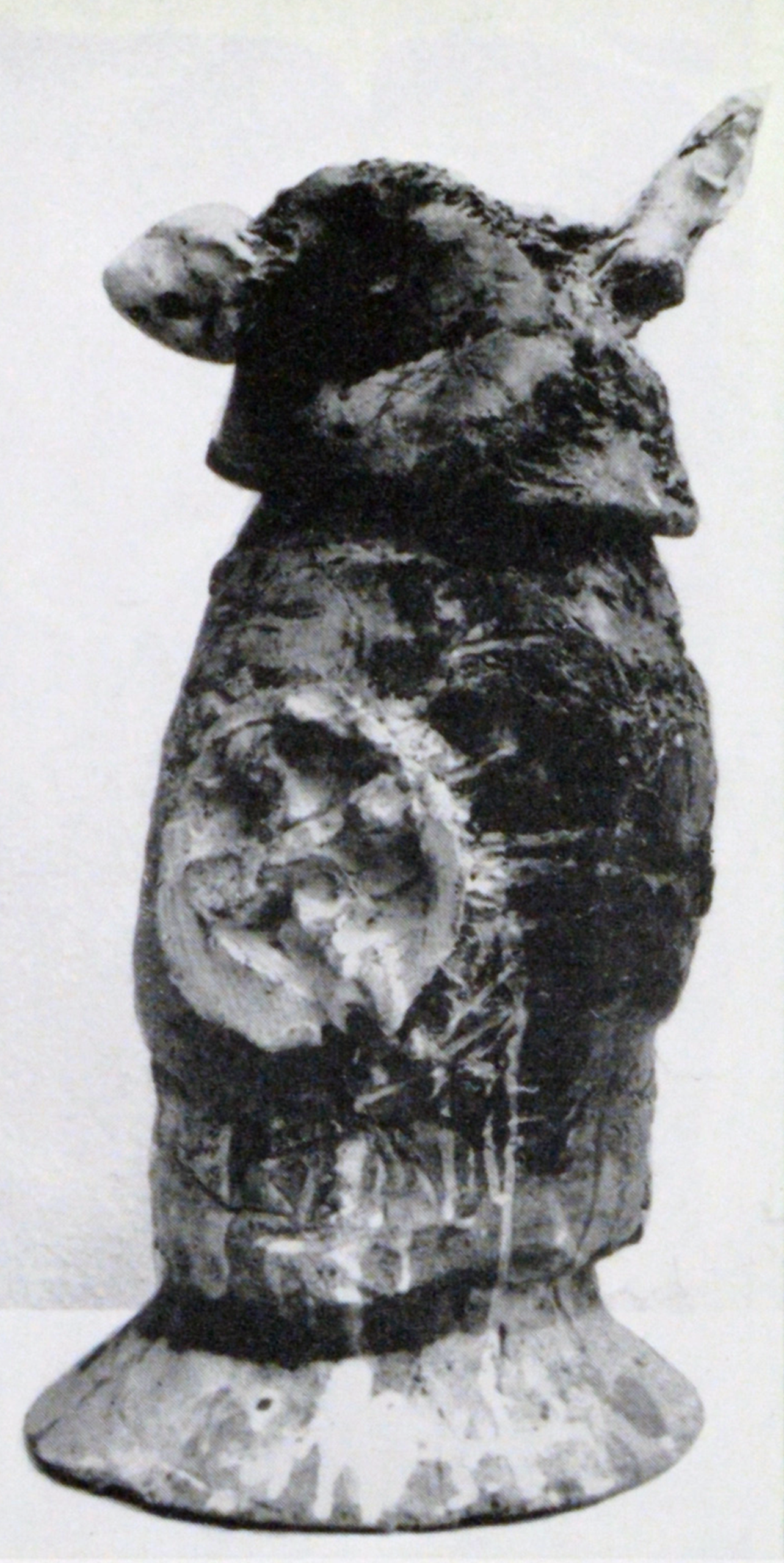 Covered jar with hornlike appendages.