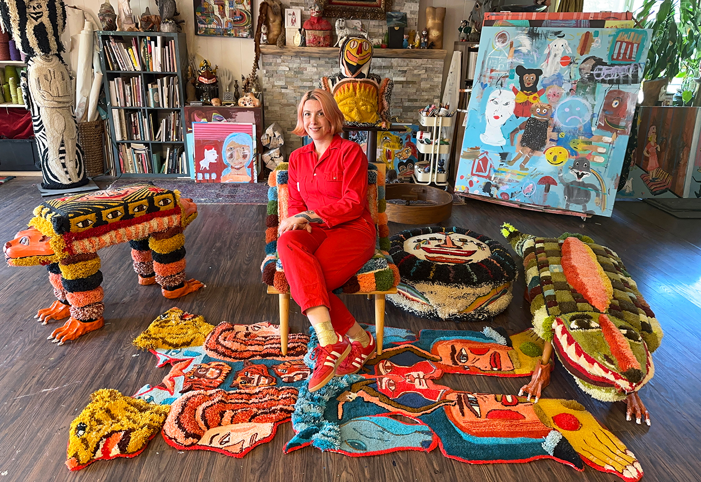 Melissa Monroe surrounded by tufted works in in her Portland, Oregon, studio.