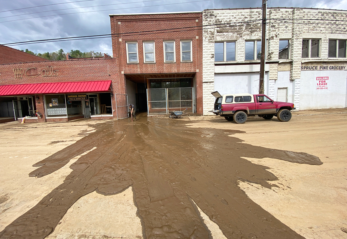 Flooded studio leaks water onto the street.