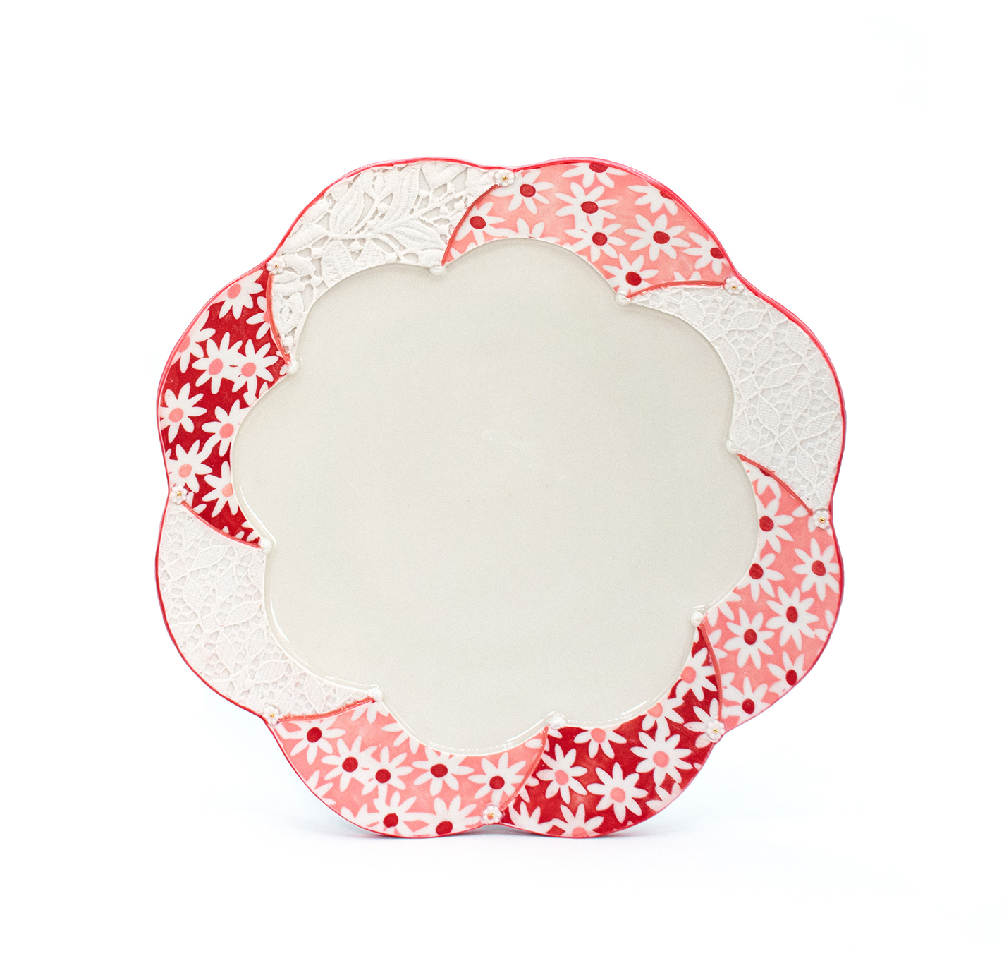 Scalloped platter with floral patterns and lace