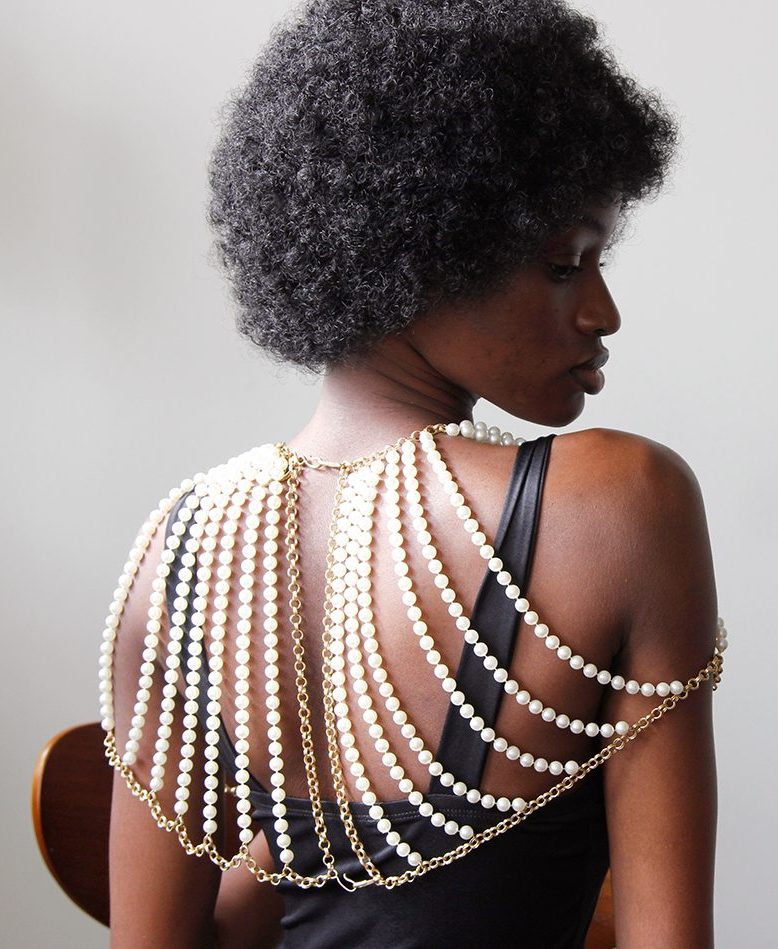 Mode wears elaborate pear and metal cape