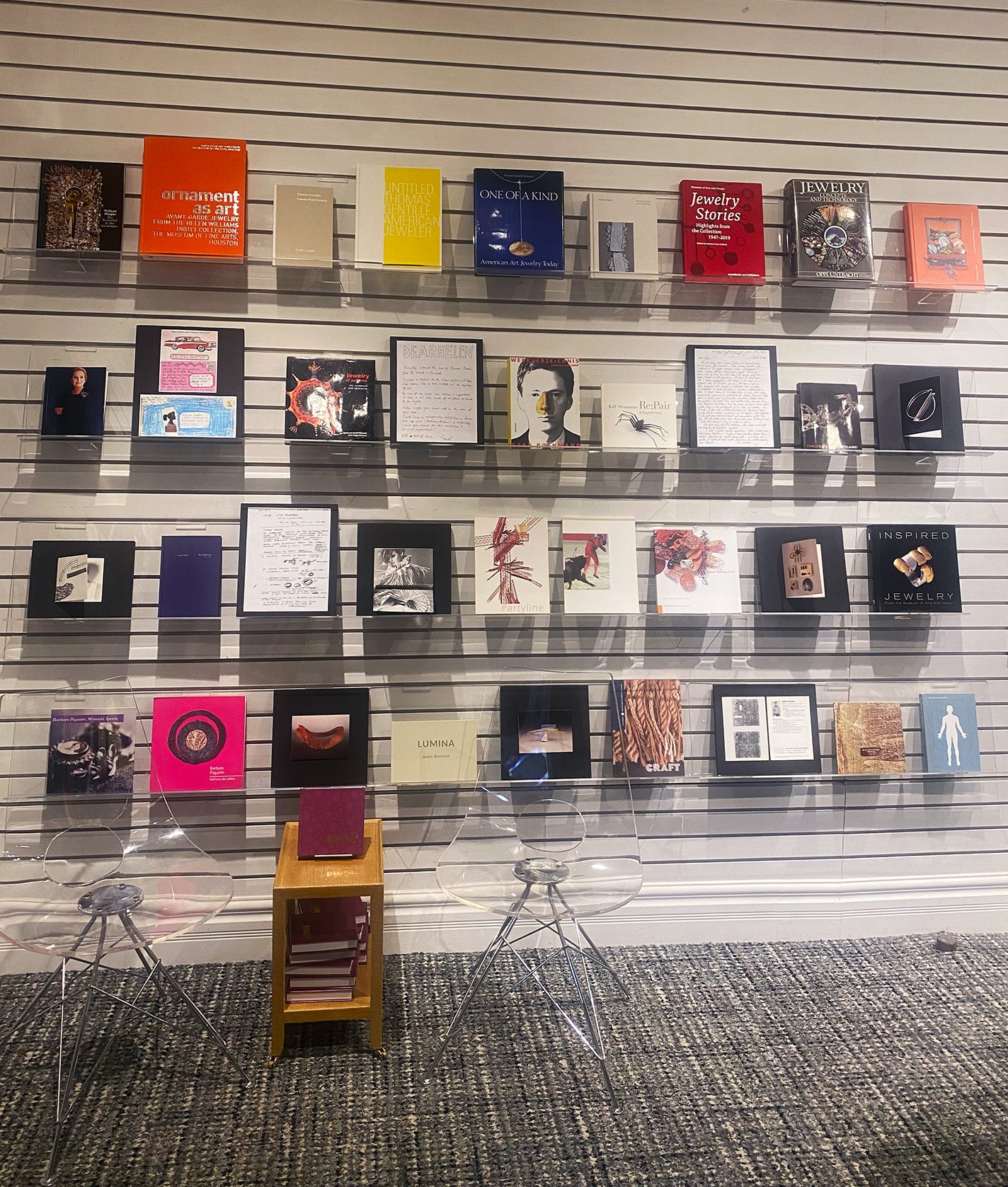Collection of jewelry books arranged on shelves