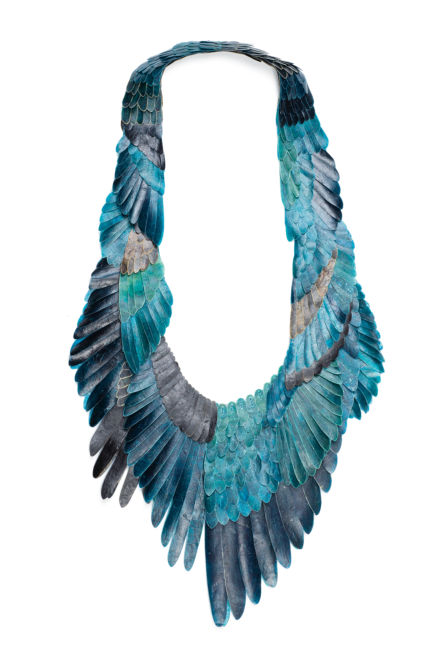 Blue winglike necklace made from cow intestine, thread, and ink.