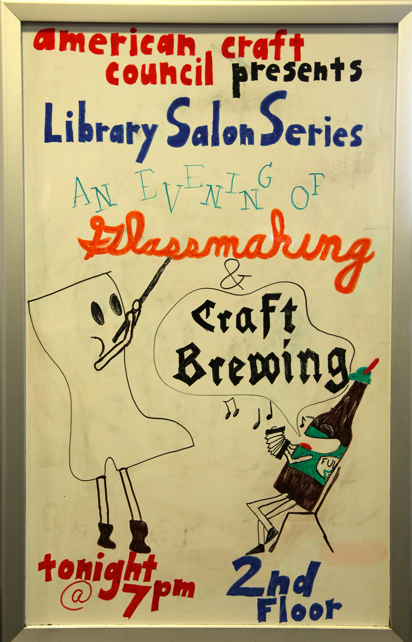 Handwritten sign promoting a salon event at the ACC Library & Archives.