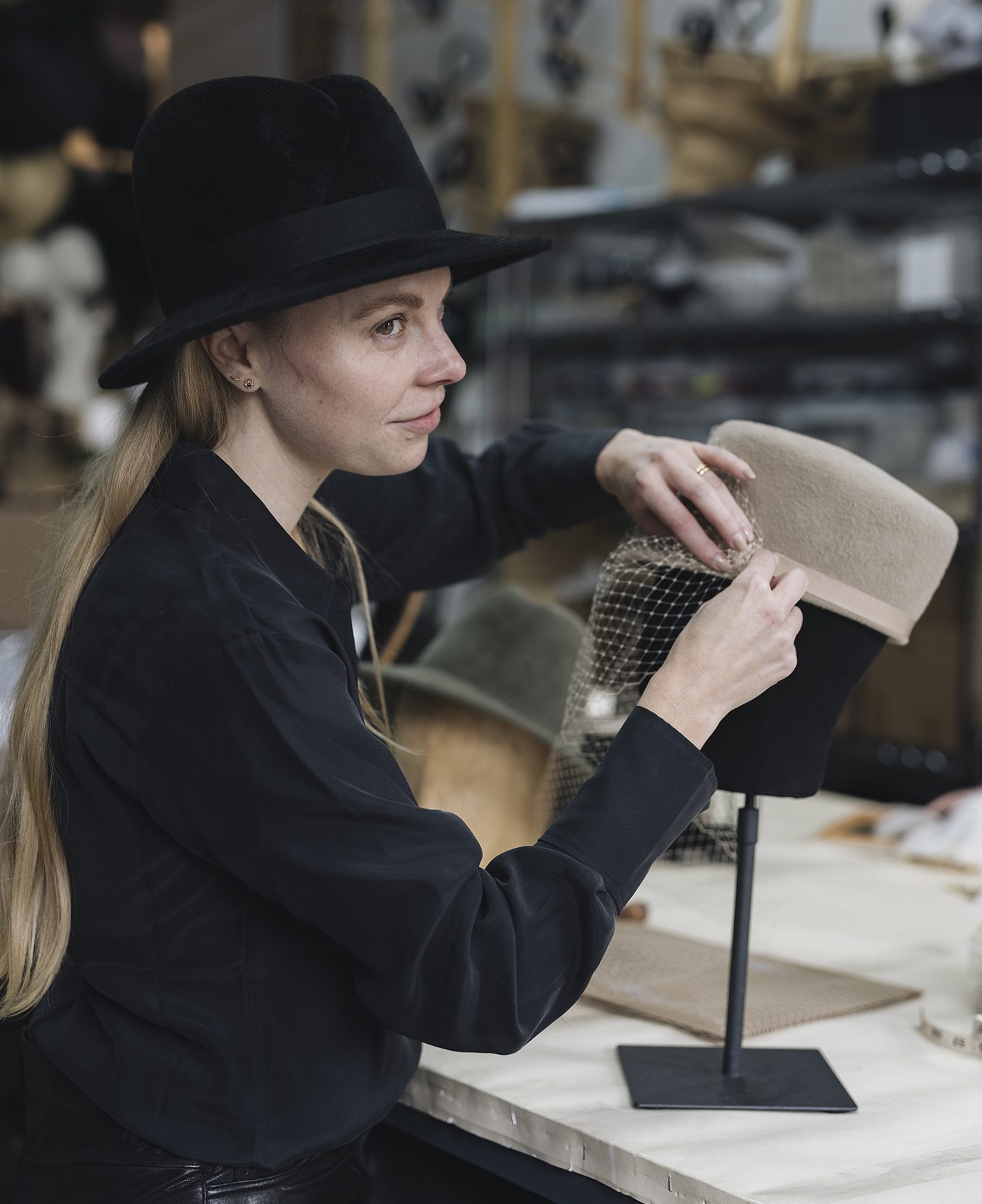 Milliner Gigi Burris O’Hara works on a handcrafted hat.