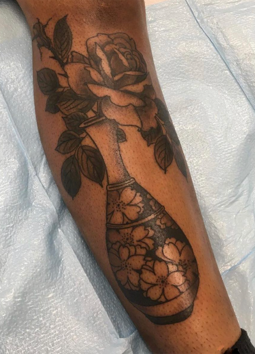 Tattoo of vase with flowers